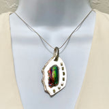 rainbow colored roman glass pendant with peridot
